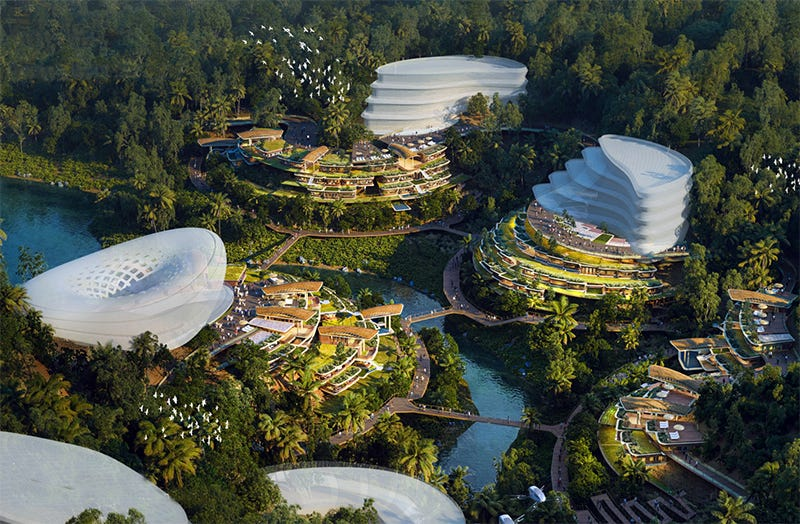 An aerial view, conceptual image of Prospera showing large, white buildings shaped like chloroplasts connected via bridges over lush jungle and waterways.