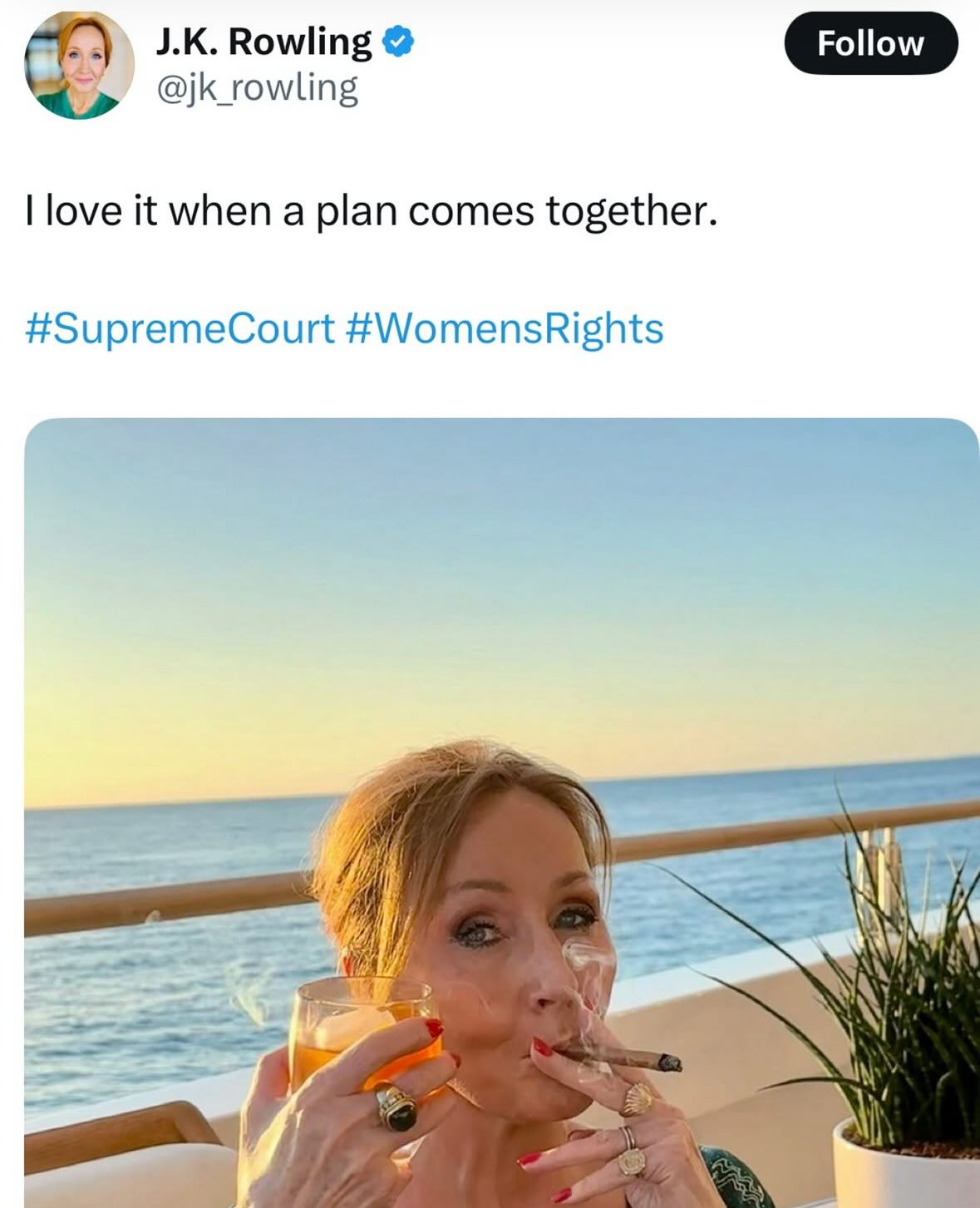 JK Rowling sipping a cocktail and smoking a cigar on what appears to be a yacht as she celebrates the UK Supreme Court ruling removing legal protections for trans women.