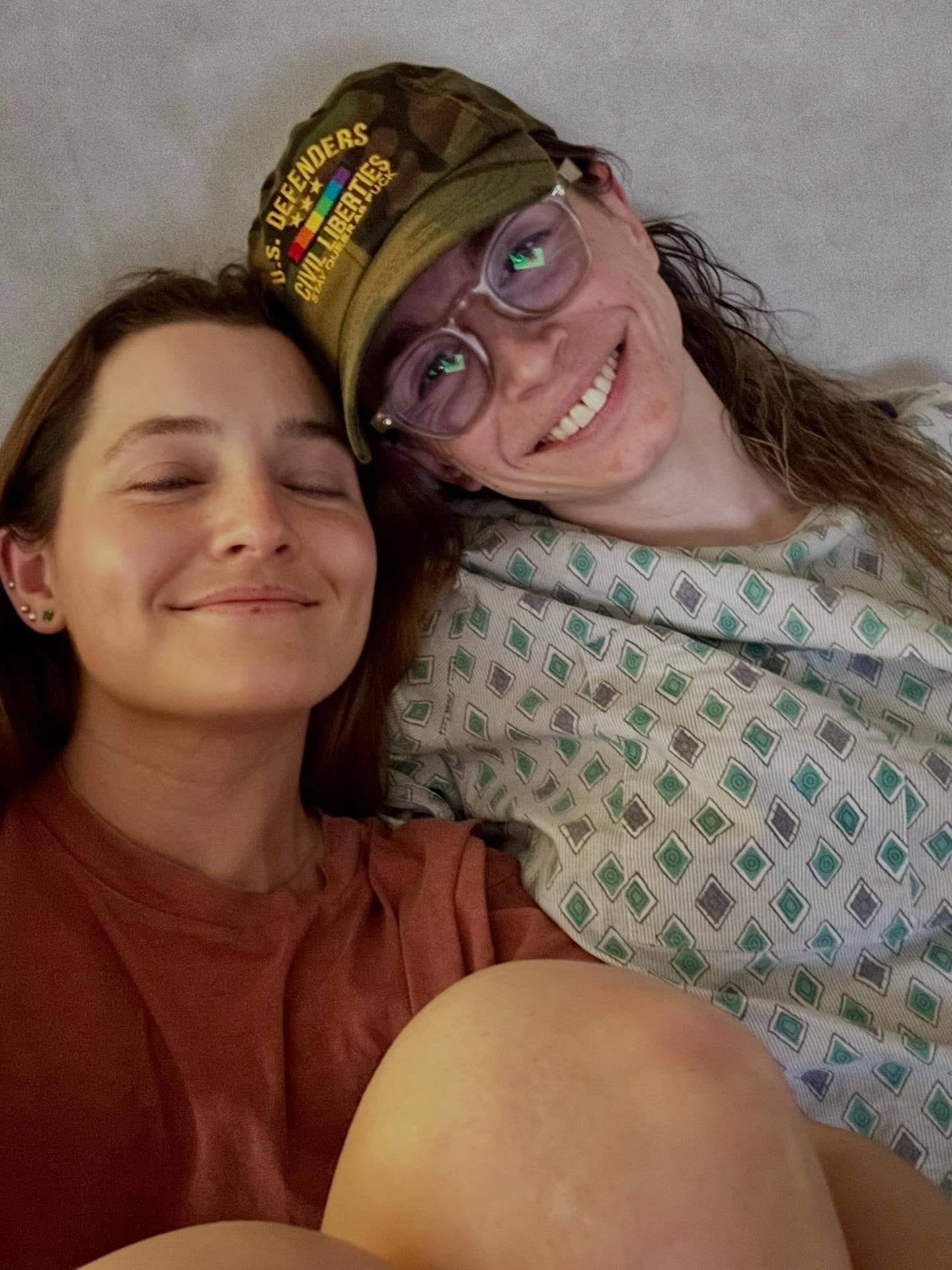 Grace and a friend smiling together during recovery.