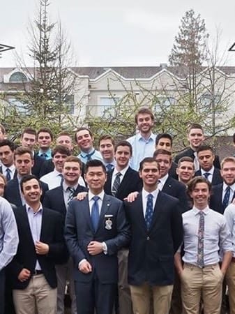 An archival group photograph of fraternity members outside.